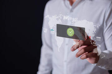 Businessman touching virtual secure payment icon on digital world map, representing online banking, e-commerce, financial technology, cybersecurity global money transactions.