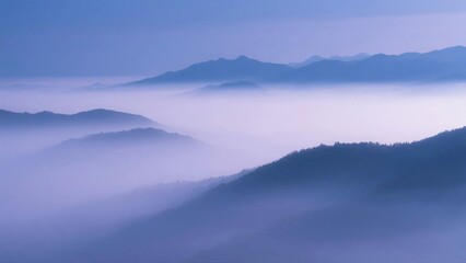 Fototapeta premium Misty Mountains with Layers of Hazy Blue Tones and Serene Scenery