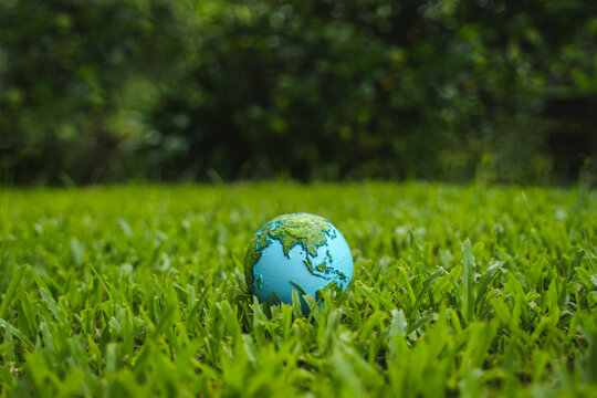 Protecting the green tree world with environment icons on nature background. Ecology and environment concept.