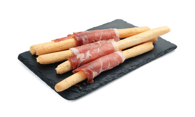 Delicious grissini sticks with prosciutto isolated on white