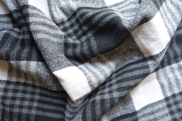Rumpled black and white checkered cotton flannel fabric