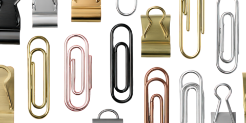 Assorted Metallic Paperclips On Black Background