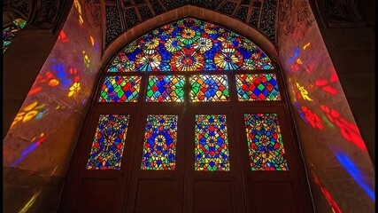 Beautiful stained glass window inside cathedral with sunlight shining through colorful religious patterns for architecture and culture heritage - Powered by Adobe