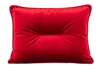 A vibrant red pillow with a textured surface is presented against a pure black backdrop.