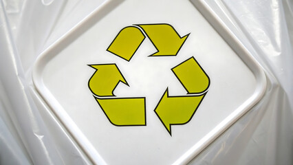 Green Recycling Symbol on Translucent Plastic Surface – Eco-Friendly Concept