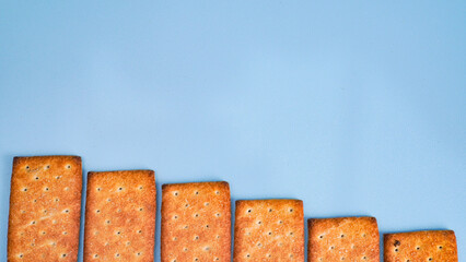 Flat lay view of biscuit on light blue background