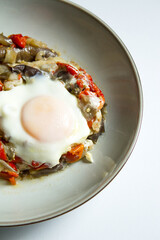 Cooked vegetables with poached egg