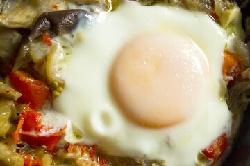 Cooked vegetables with poached egg