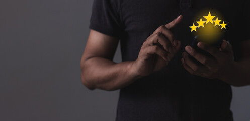Excellence Review, Young Man hand holding Smart Phone with five star to review and give 5 stars with very good results in service, Good review 5 star rating choice feedback