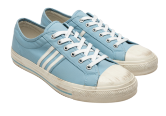 Isolated pair of light blue casual sneakers, canvas shoes with white laces and stripes