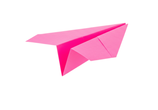 Isolated pink paper airplane on plain backdrop perfect for education or imagination concepts