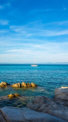 Sailboat on Calm Blue Waters of Greek Coastline
