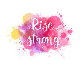 Pink colored watercolor paint splash with small dots decoration. Rise strong - motivational message. Handwritten modern calligraphy lettering text