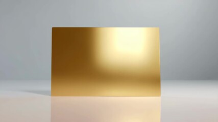 Shiny gold metal sheet standing upright, minimalistic photo style, on a glossy surface with soft grey background, concept of luxury and design - Powered by Adobe
