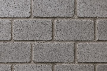 Obraz premium Close-up of a Gray Cinder Block Wall Showing Texture and Pattern for Construction Backgrounds