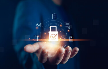 Businessman hand holding digital padlock with check mark and document icons, concept of cybersecurity, data protection, secure business process, compliance, privacy, and information security system.