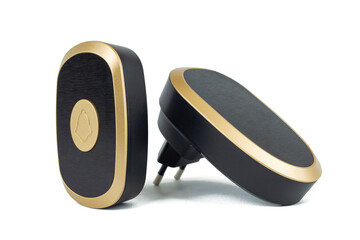 View of a modern, sleek wireless doorbell. The set includes a black and gold push button transmitter and a plug-in receiver, both featuring a stylish, minimalist design.