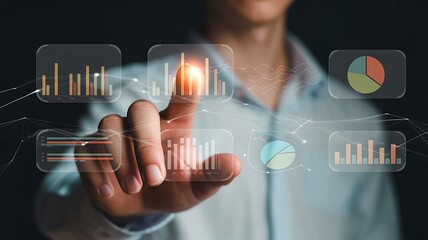 Businessman touching a virtual interface displaying graphs and charts representing data analysis and business strategy