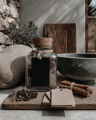 Apothecary jar with herbs and spices | Natural ingredients, cinnamon sticks, and black label tag | Rustic botanical flat lay | Artisan packaging mockup background