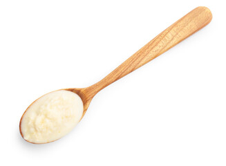 Tasty horseradish sauce in spoon isolated on white, top view