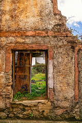 Rural architecture in Spain, abandoned and semi-ruined due to migration to cities, with daylight illumination.