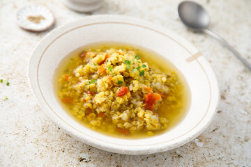 Homemade lentil soup served with microgreens