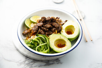 Rice with beef and avocado