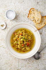 Homemade lentil soup served with microgreens