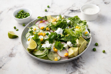 Healthy spring salad with avocado