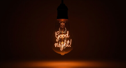 Glowing lightbulb with a "Good night!" message in the filament. Cozy and peaceful concept for wishing a restful sleep.