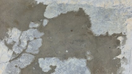 Old grey concrete floor with stains, fading, peeling paint, scratches, sidewalk, road surface,...