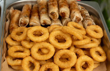 Deep fry seafood set with calamari rings, crispy gyoza dumplings, shrimps and spring rolls