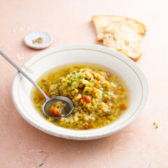 Homemade lentil soup served with microgreens