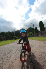 little boy on a balance bike
