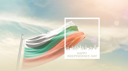 Bulgaria flag waving proudly under a bright sky with text happy independence day. Bulgaria national flag for independence day.