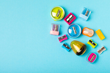 Pencil sharpener on bright colored background. Pencil and pencil shavings. Stationery. School...