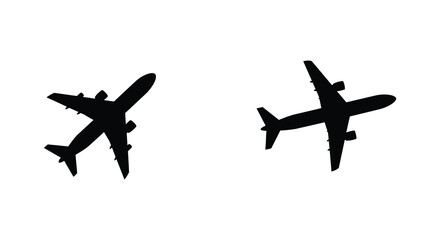 Two black silhouettes of airplanes viewed from directly above