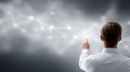 Focused business strategist from behind pointing at glowing digital network. businessman making connection on transparent futuristic interface with innovation and technology