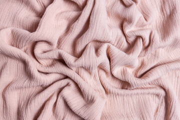 A soft pink textured linen fabric background that is perfect for creating stylish and elegant...