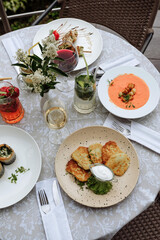 A beautifully set table with various dishes and drinks, perfect for a restaurant scene.