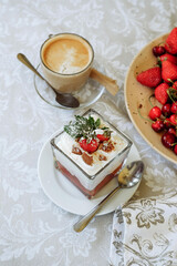 A delicious dessert with coffee and fresh fruit on a table.