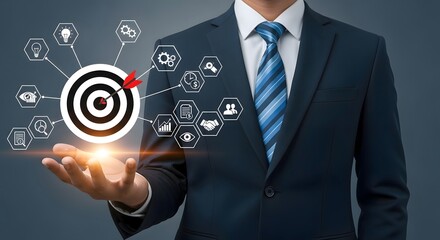 Businessman presenting a target with an arrow and business icons floating above his outstretched hand