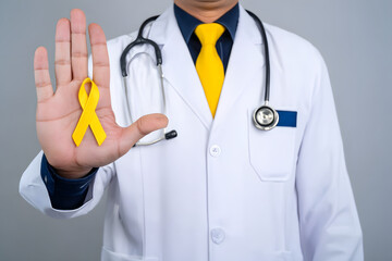 Doctor in white coat holding yellow ribbon, isolated stock photo with transparent background for health awareness campaigns
