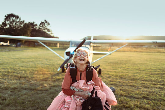 Joyful skydiver with parachute