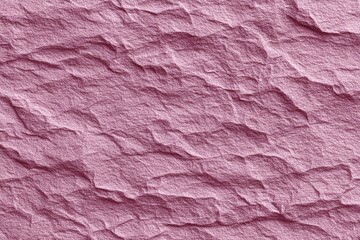 Soft pink crinkled paper texture showcasing intricate details and subtle color variations in natural light