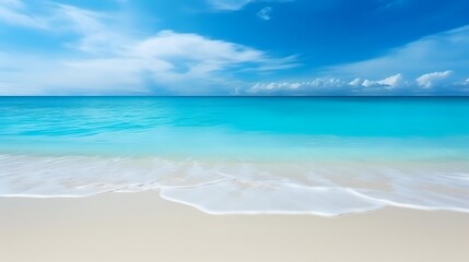 Fototapeta premium Pristine turquoise ocean waves gently rolling onto white sandy beach under bright blue sky with wispy clouds, creating serene tropical paradise atmosphere.