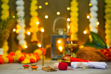 Festive background for Deepavali celebration, featuring sacred pooja samagri and a lit oil lamp | Indian festive decor, Vibrant and colorful setup for a traditional Indian cultural celebration or reli