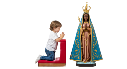 Small child kneels in prayer before statue of Nossa Senhora Aparecida in a peaceful setting