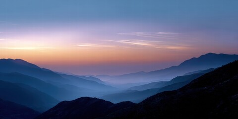 Obraz premium Serene Mountain Sunset with Misty Valleys