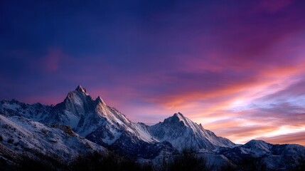 Fototapeta premium Majestic Snow-Capped Mountain Range at Sunset